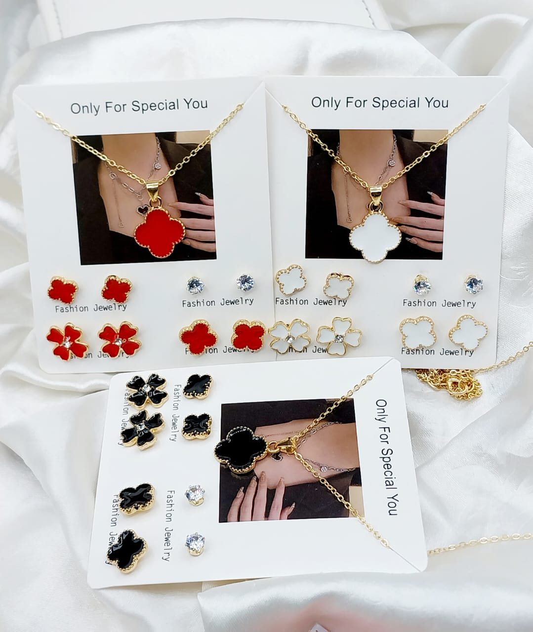 Pack of four (4) pairs of earrings(tops) and one 1 necklace for girls