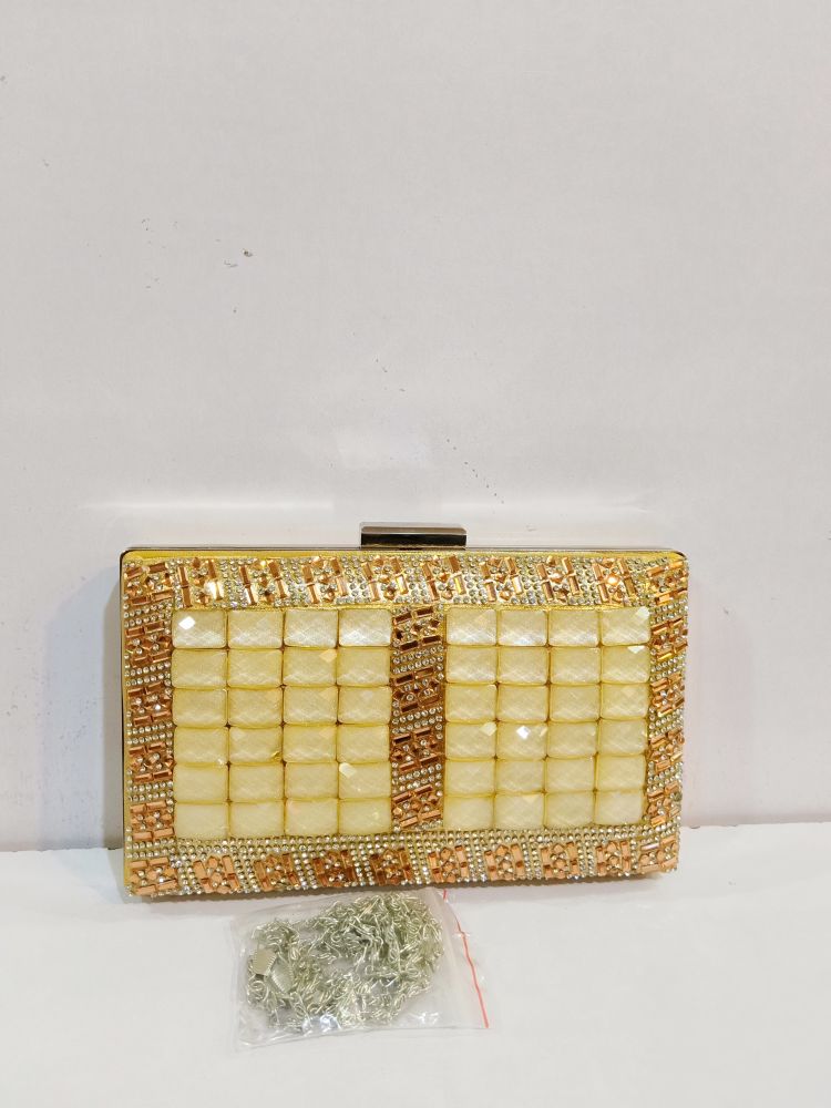 Quality Golden Metal Cut work Hand Clutch With Golden Chain. .