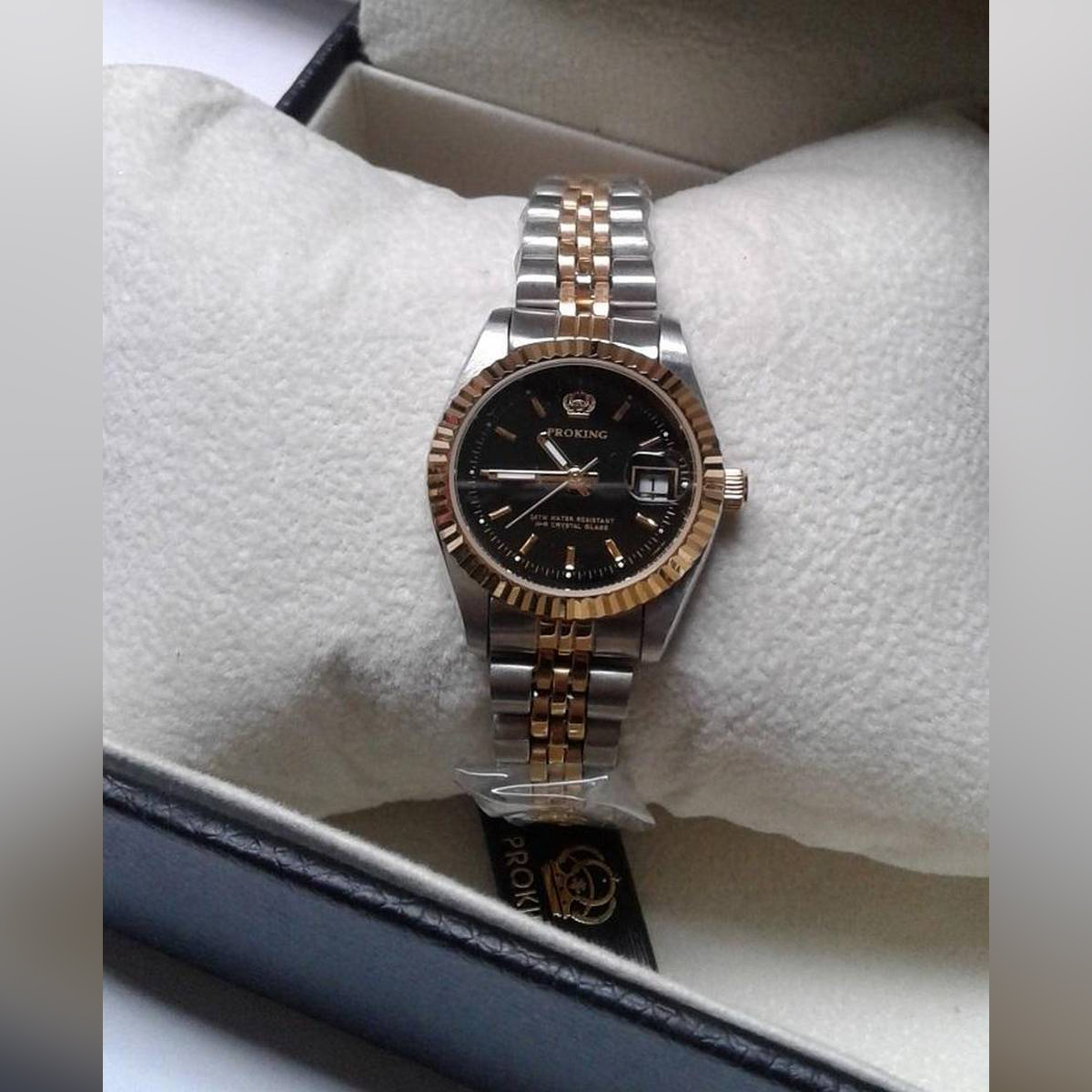 silver watch with black dial