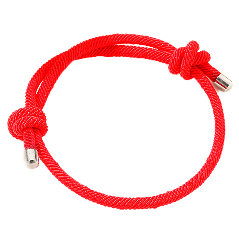 red rope on wrist