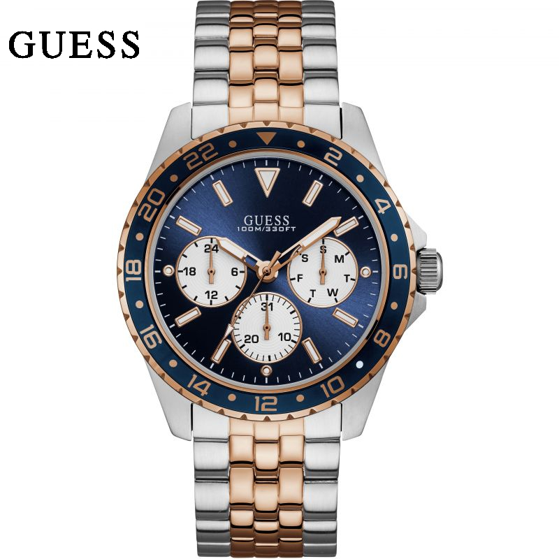 silver guess watch with blue face