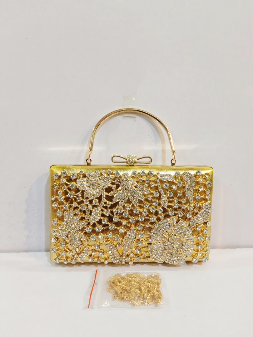 Quality Golden Metal Cut work Hand Clutch With Golden Chain. .