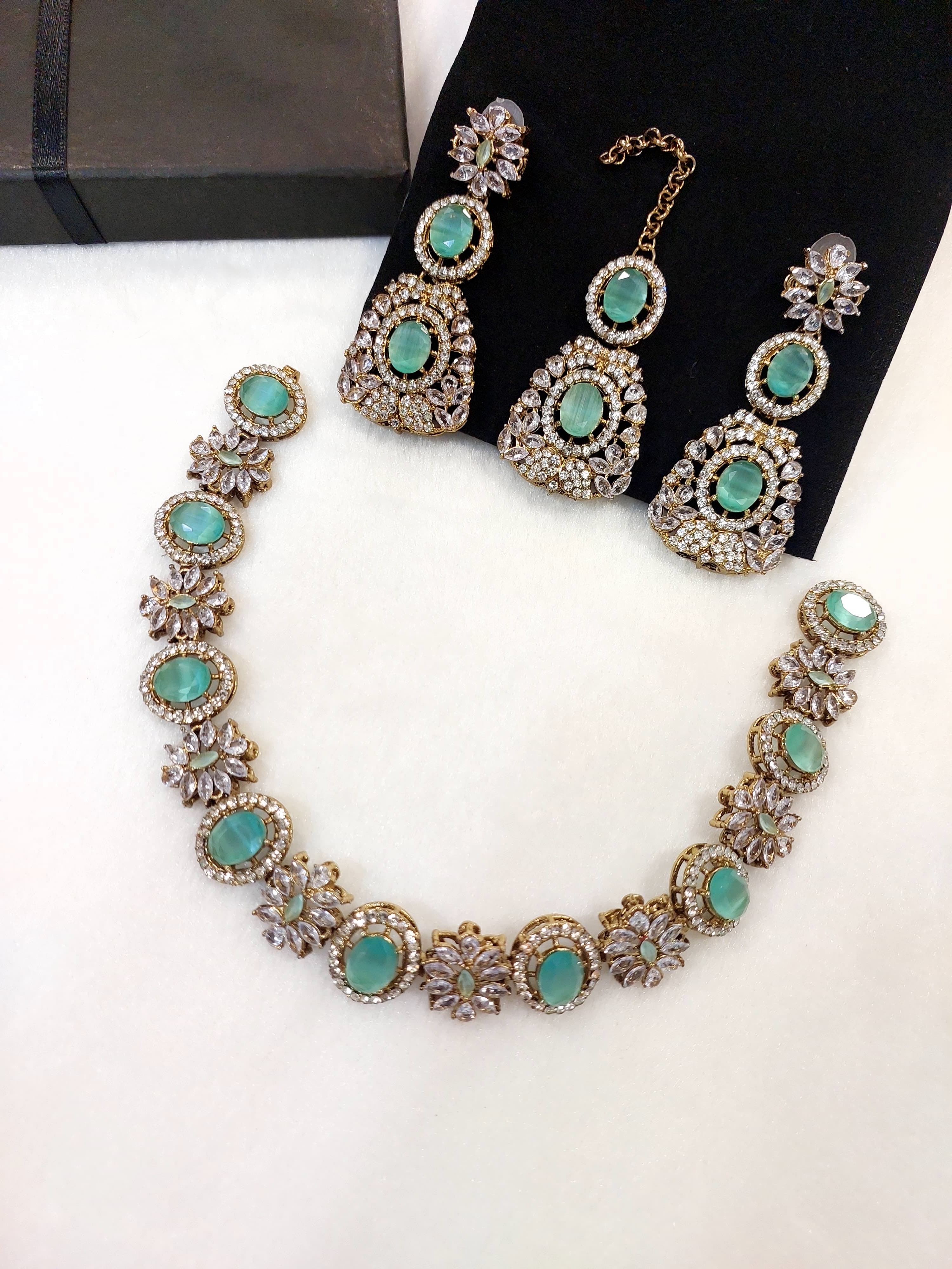 beautiful and sophisticated jewellery set with earrings and maang tikka fine quality zircon stone ,