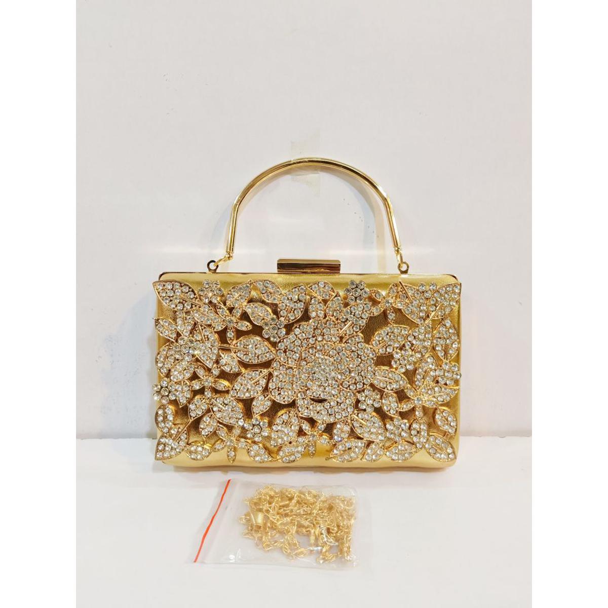 Quality Golden Metal Cut work Hand Clutch With Golden Chain. .