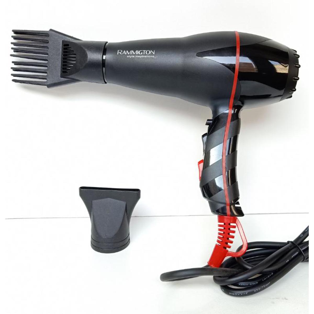Little boy drying hair with hair dryer  Photo