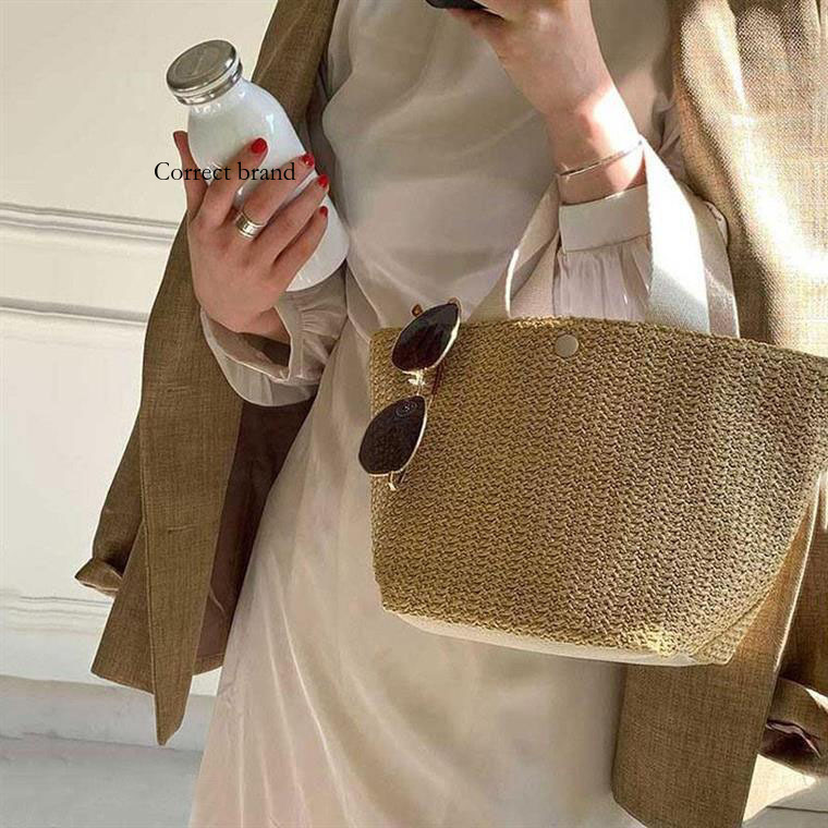 Nieuwe Bucket Ins Designer Stijl Zomer Strand Uitje Geweven Vintage Handtas van Geweven Stro Sanmi Niche Design_voghion.com