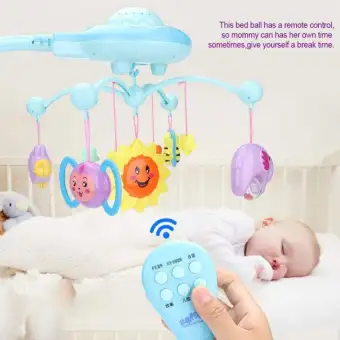 baby bed with hanging toys