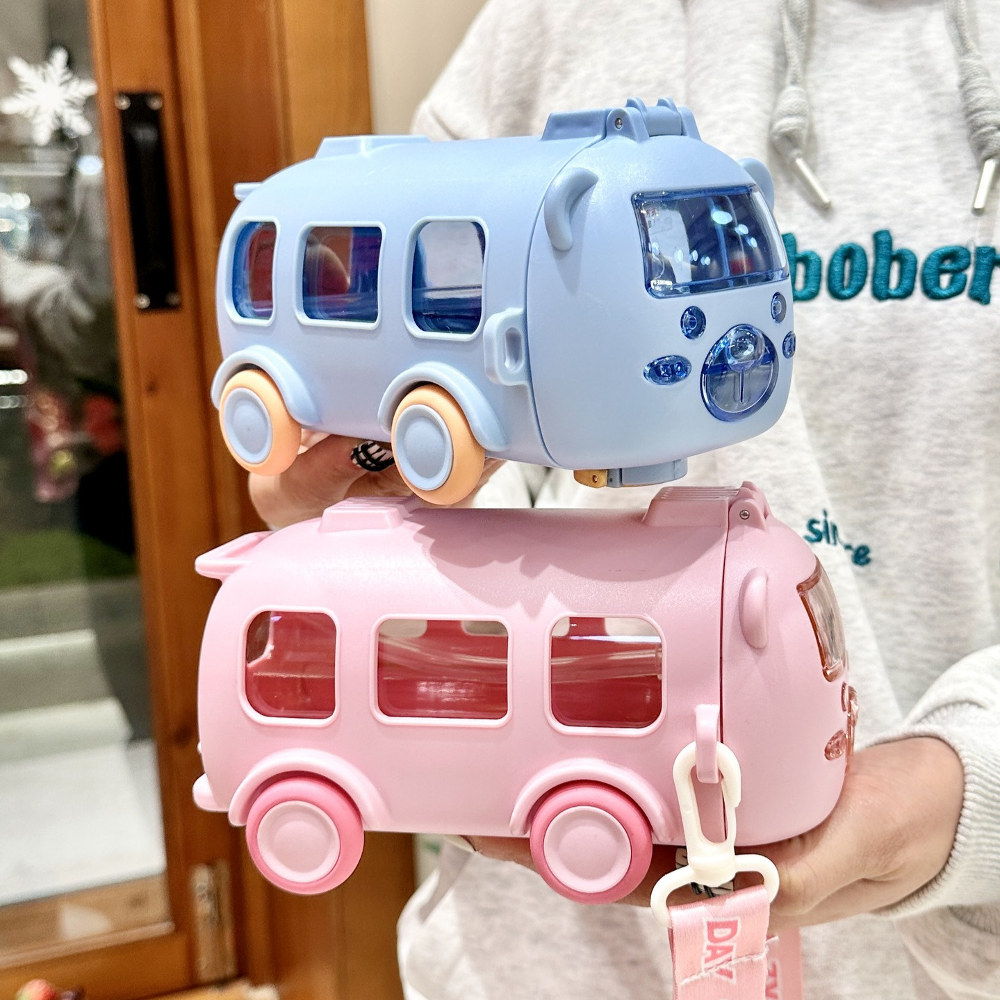 Original and high-Quality Material Bus shape cute water bottle for kids, Straw cup, Solid Wheels and Leak Proof Water and feeding Bottle with Straw & Carrying strap