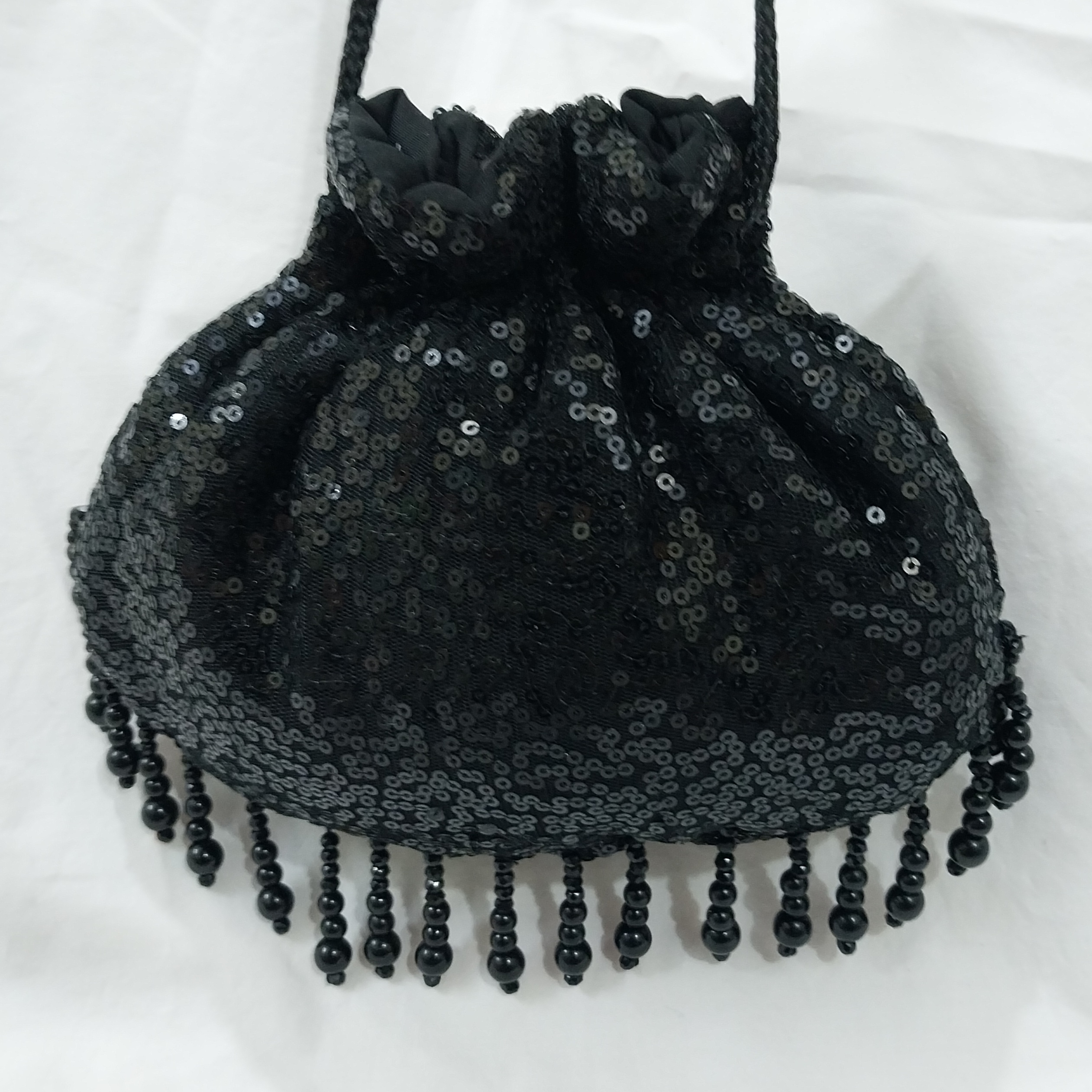 SHINY fancy potly clutch with pearl tassels
