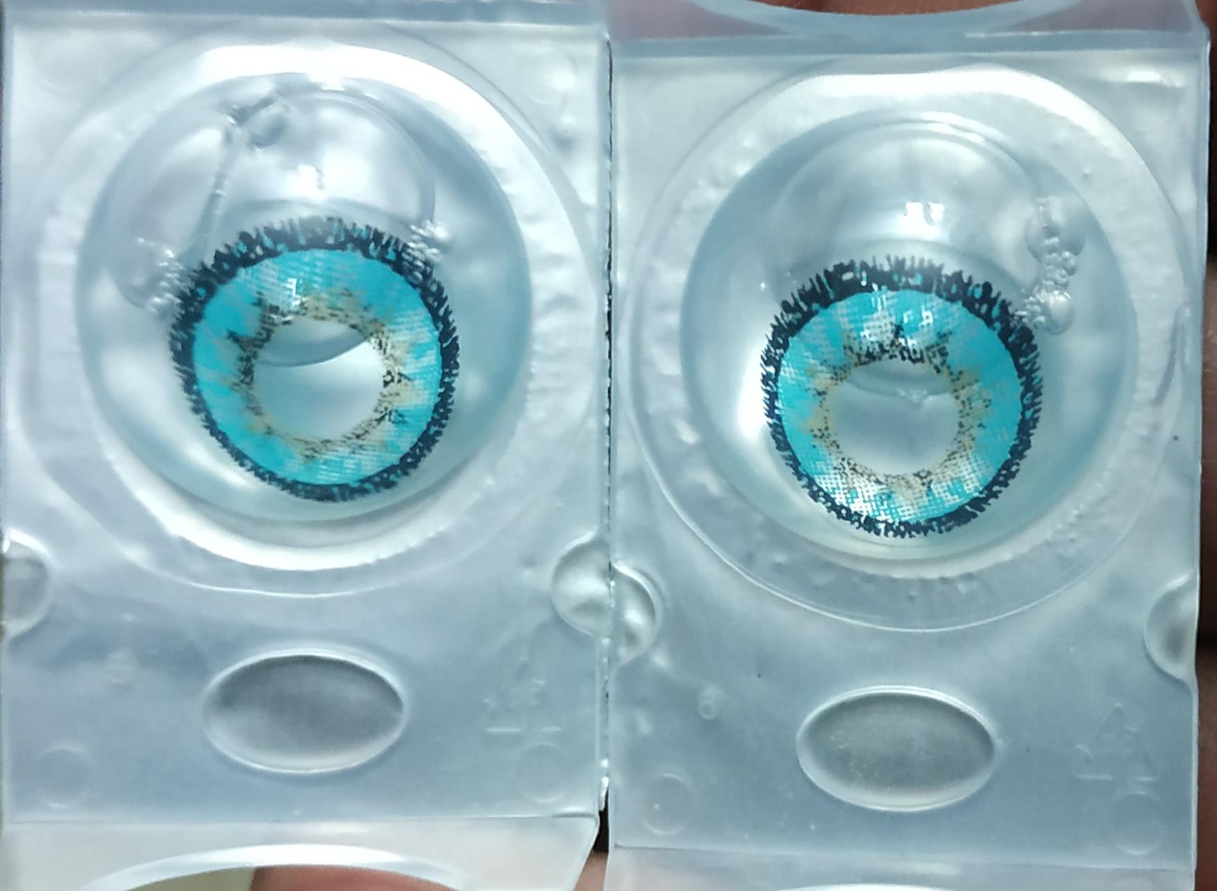 Pair Of Aqua Party Contact Lenses With Container And Solution