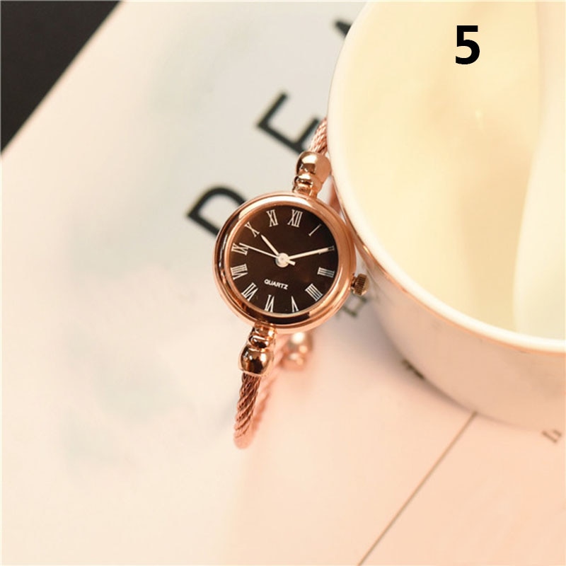 Gold bangle clearance watch for ladies