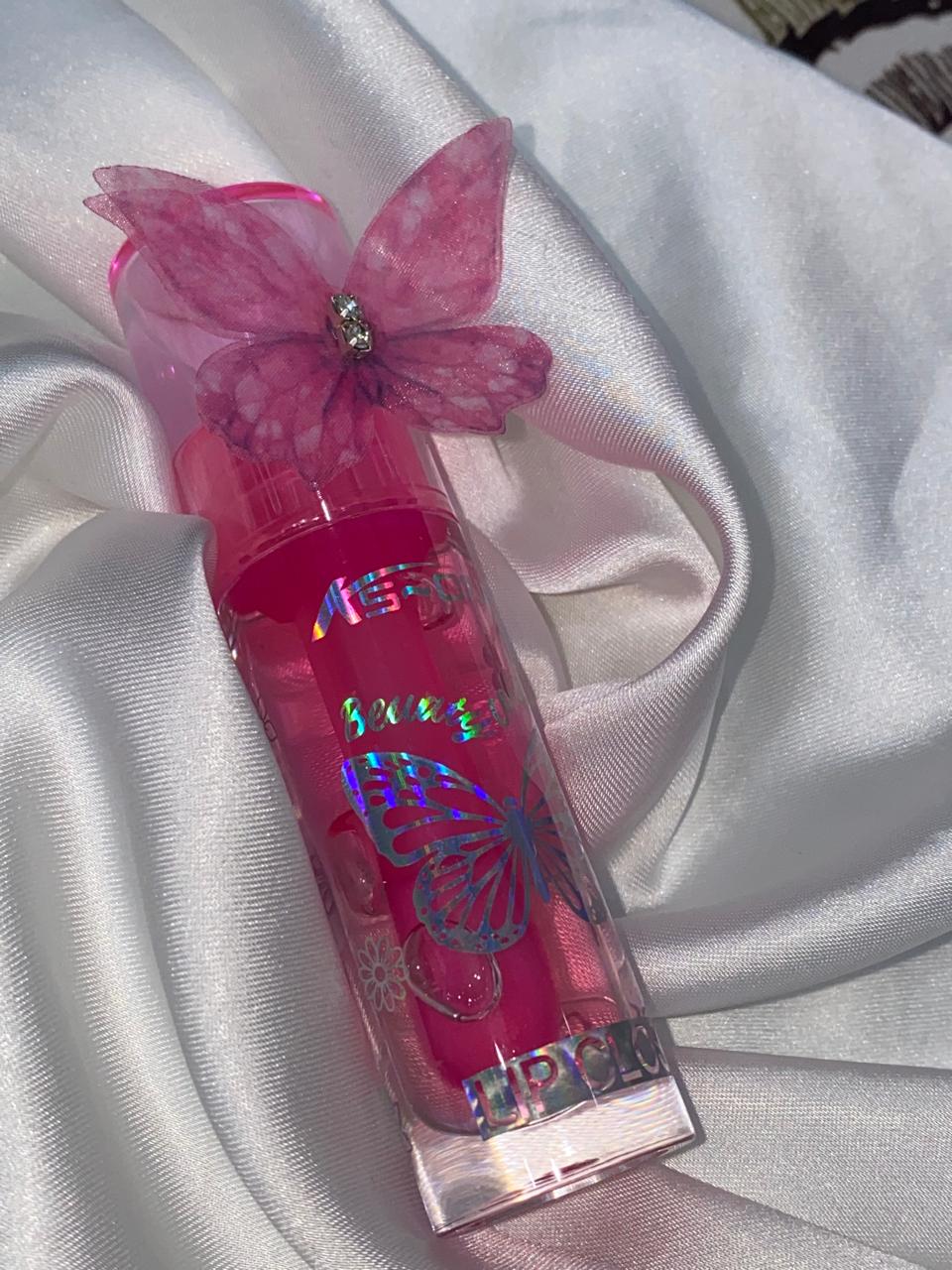 Butterfly Magic High-Shine Lip Gloss natural, luminous shine or layer it over your favorite lipstick for an extra pop of magic.