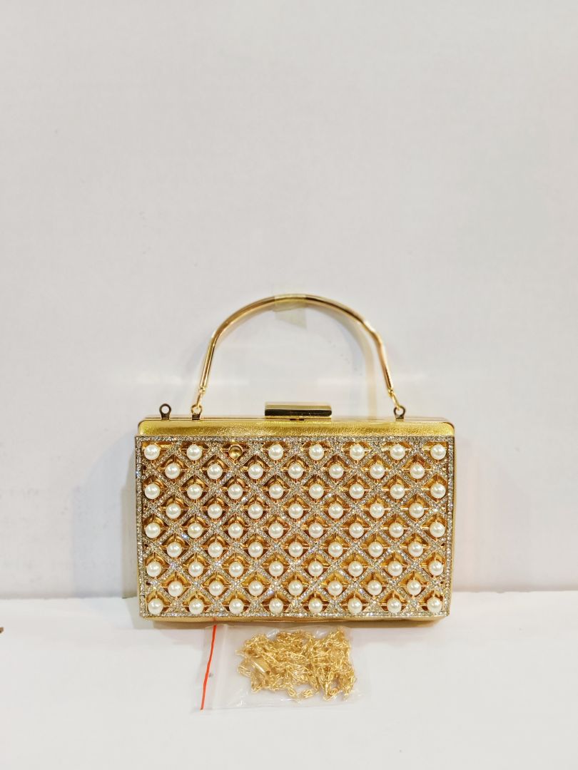 Quality Golden Metal Cut work Hand Clutch With Golden Chain. .