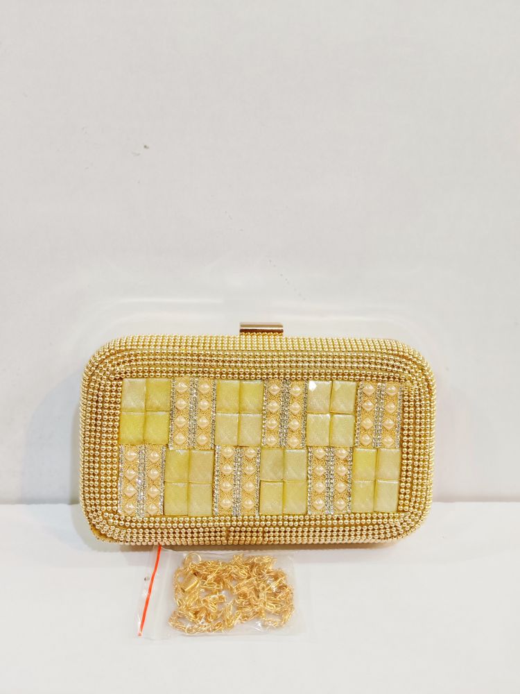 Quality Golden Metal Cut work Hand Clutch With Golden Chain. .