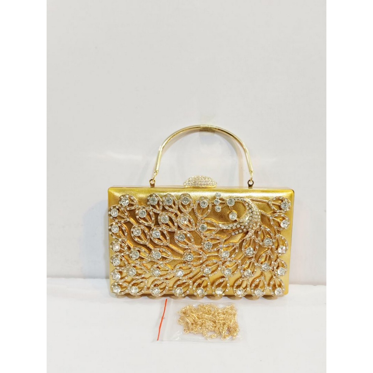 Quality Golden Metal Cut work Hand Clutch With Golden Chain. .