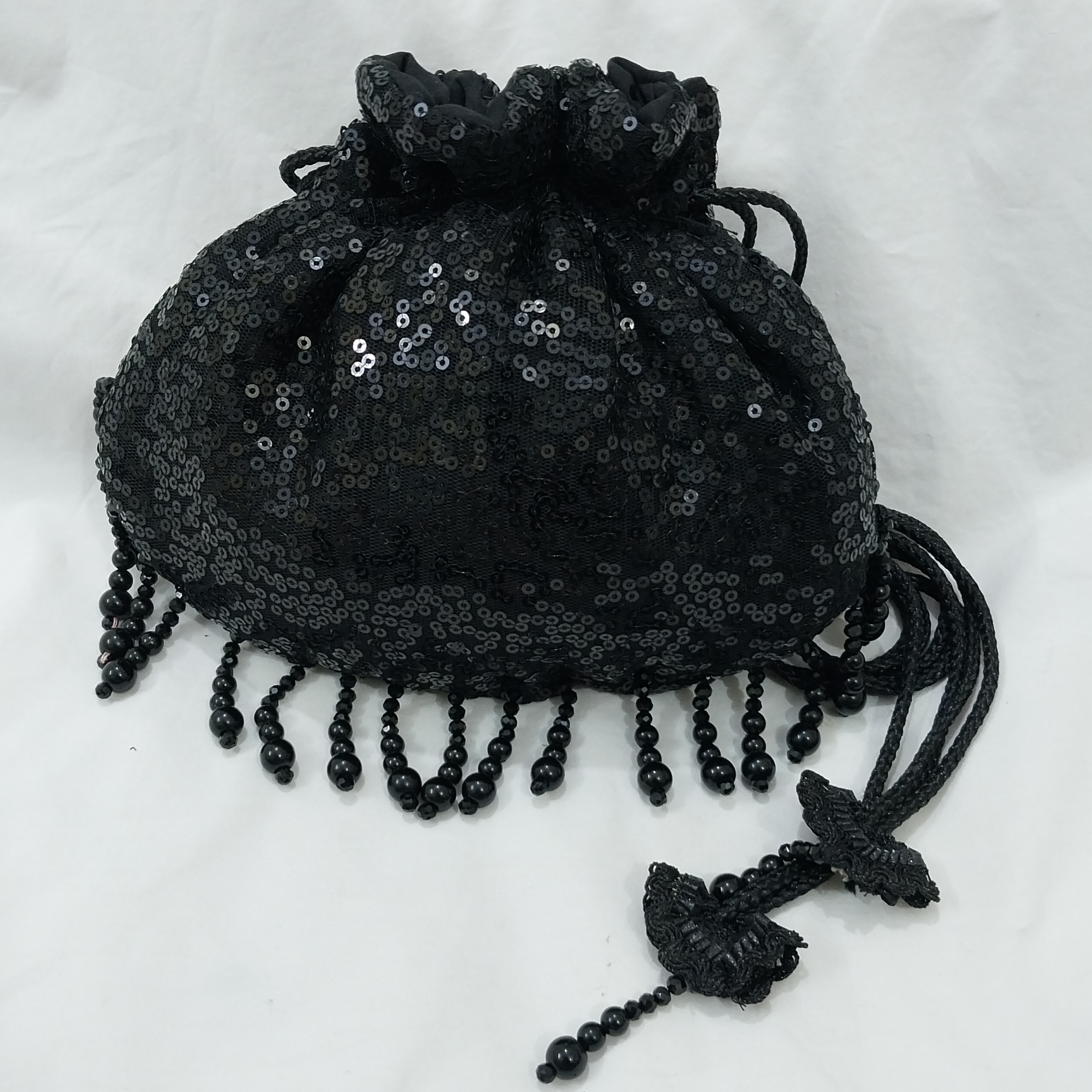 SHINY fancy potly clutch with pearl tassels