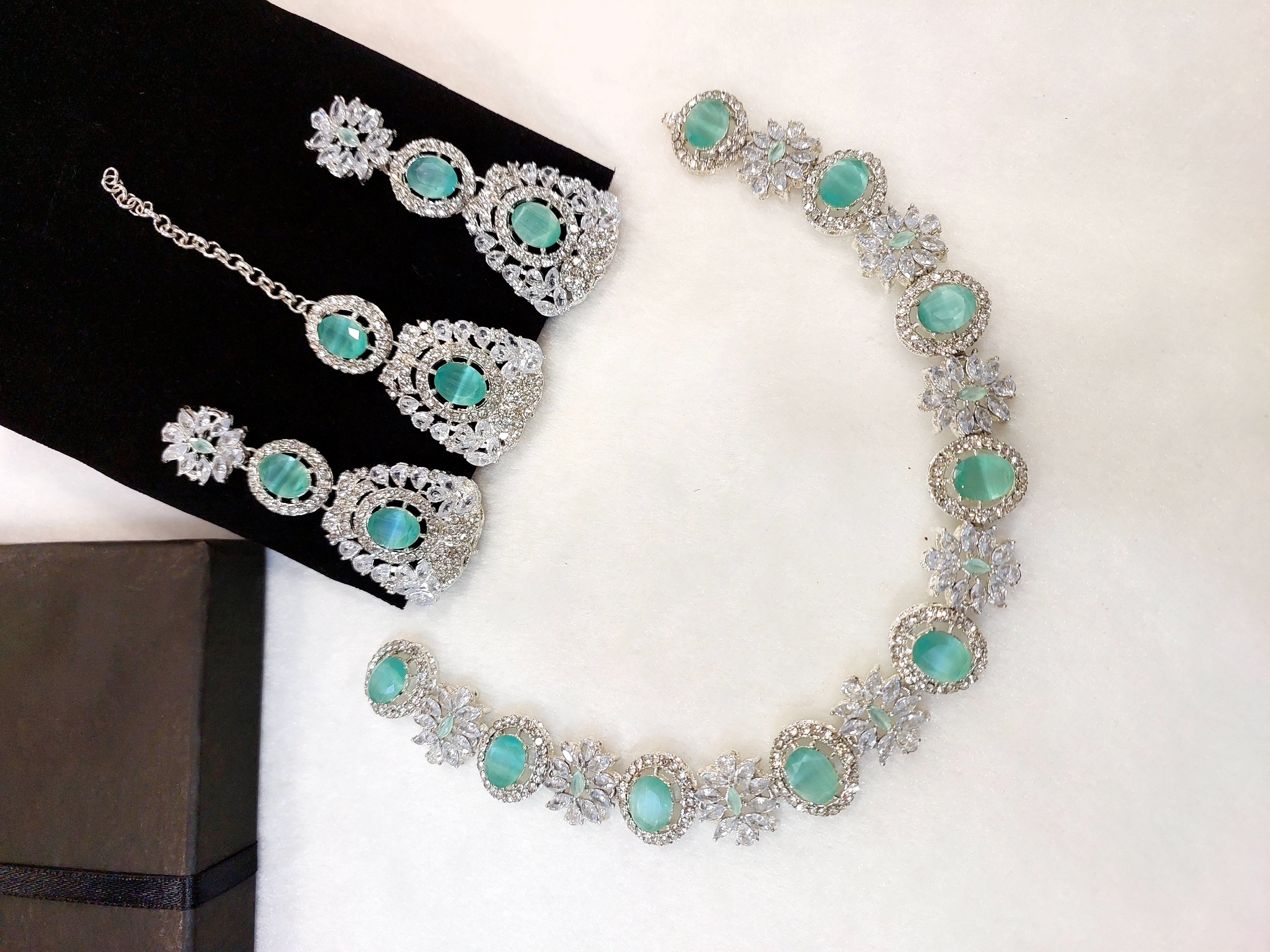 beautiful and sophisticated jewellery set with earrings and maang tikka fine quality zircon stone ,