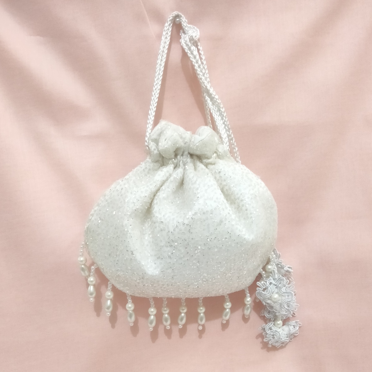 SHINY fancy potly clutch with pearl tassels