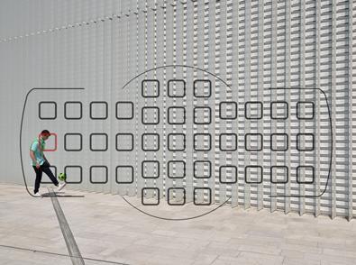 Nikon D5600 DSLR photo of a boy with a soccer ball, with the focus points overlaid on the image